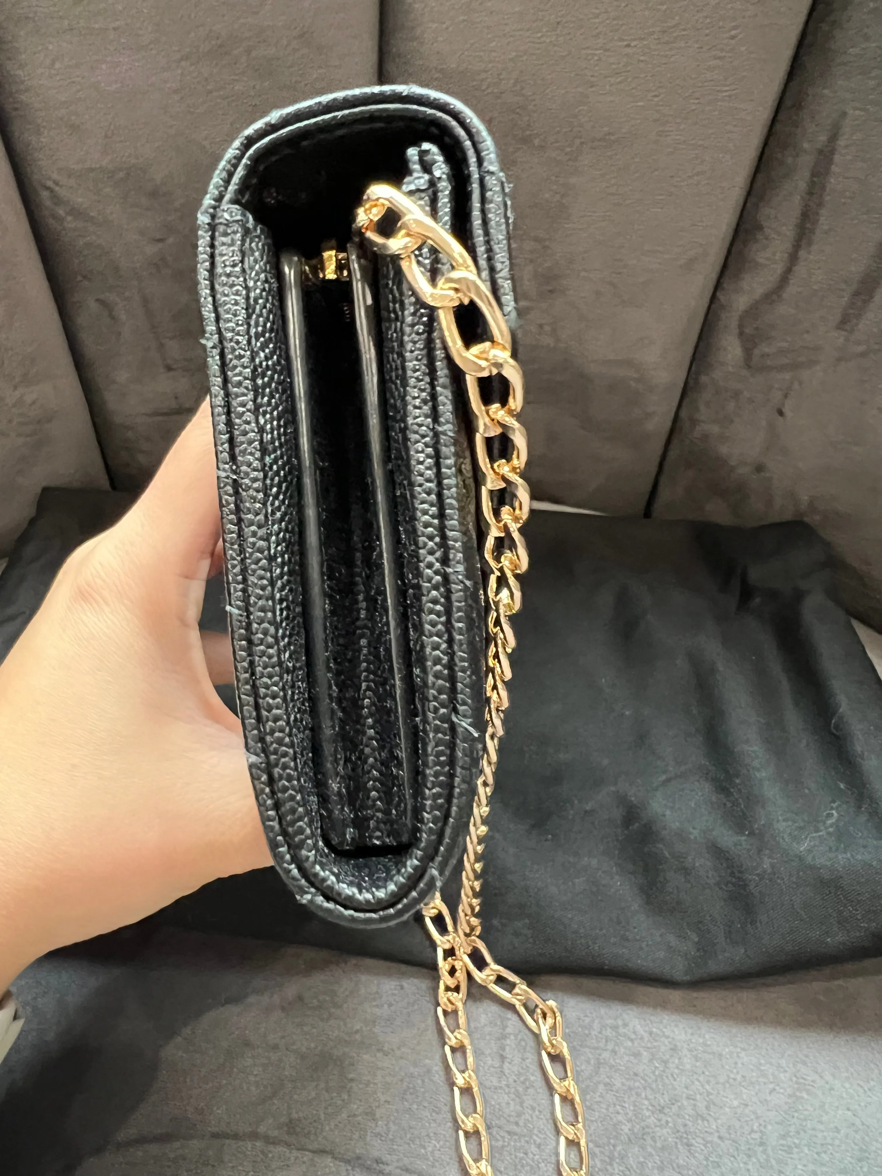 Black YSL cassandre wallet on chain