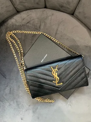 Black YSL cassandre wallet on chain