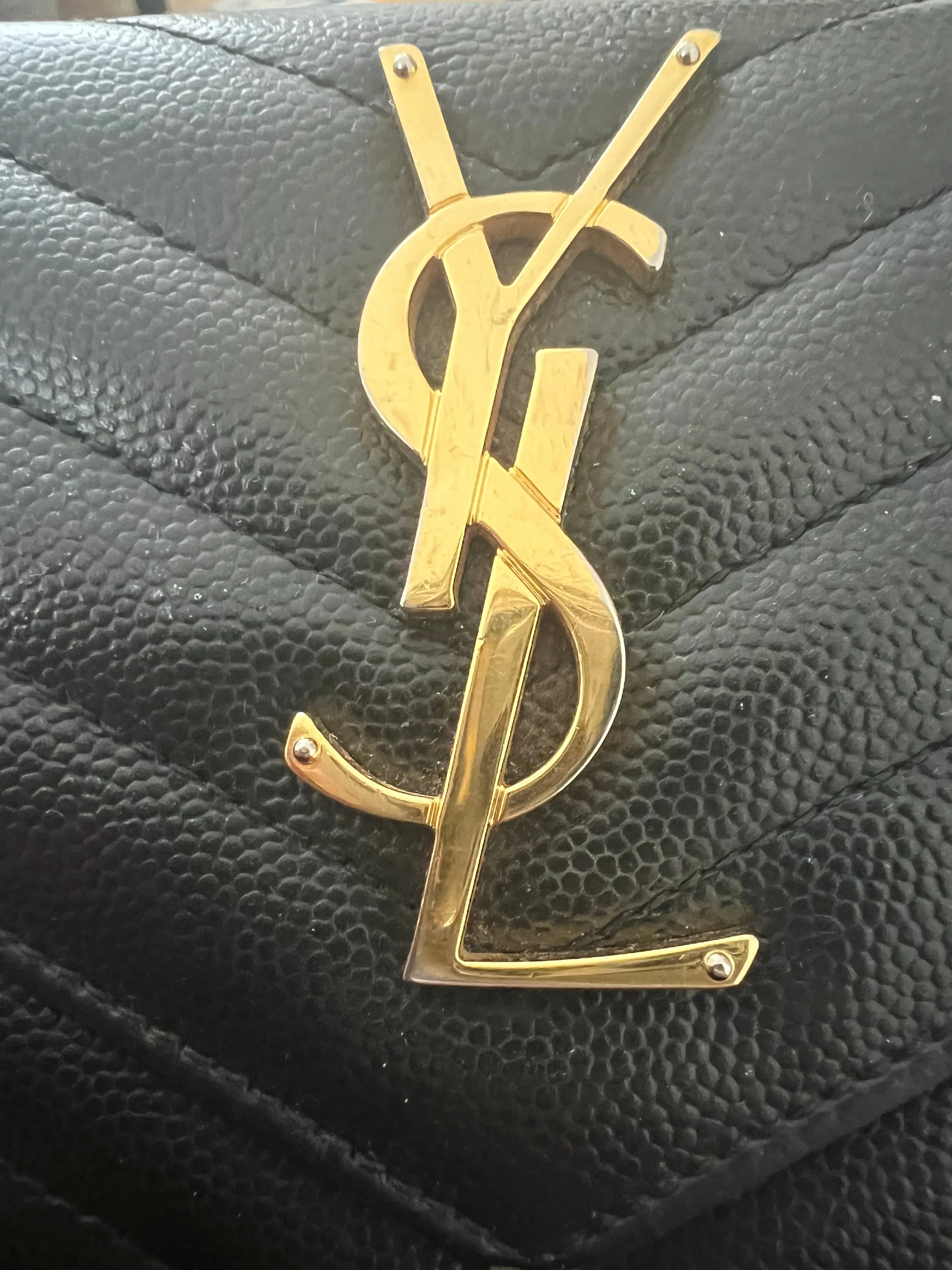 Black YSL cassandre wallet on chain