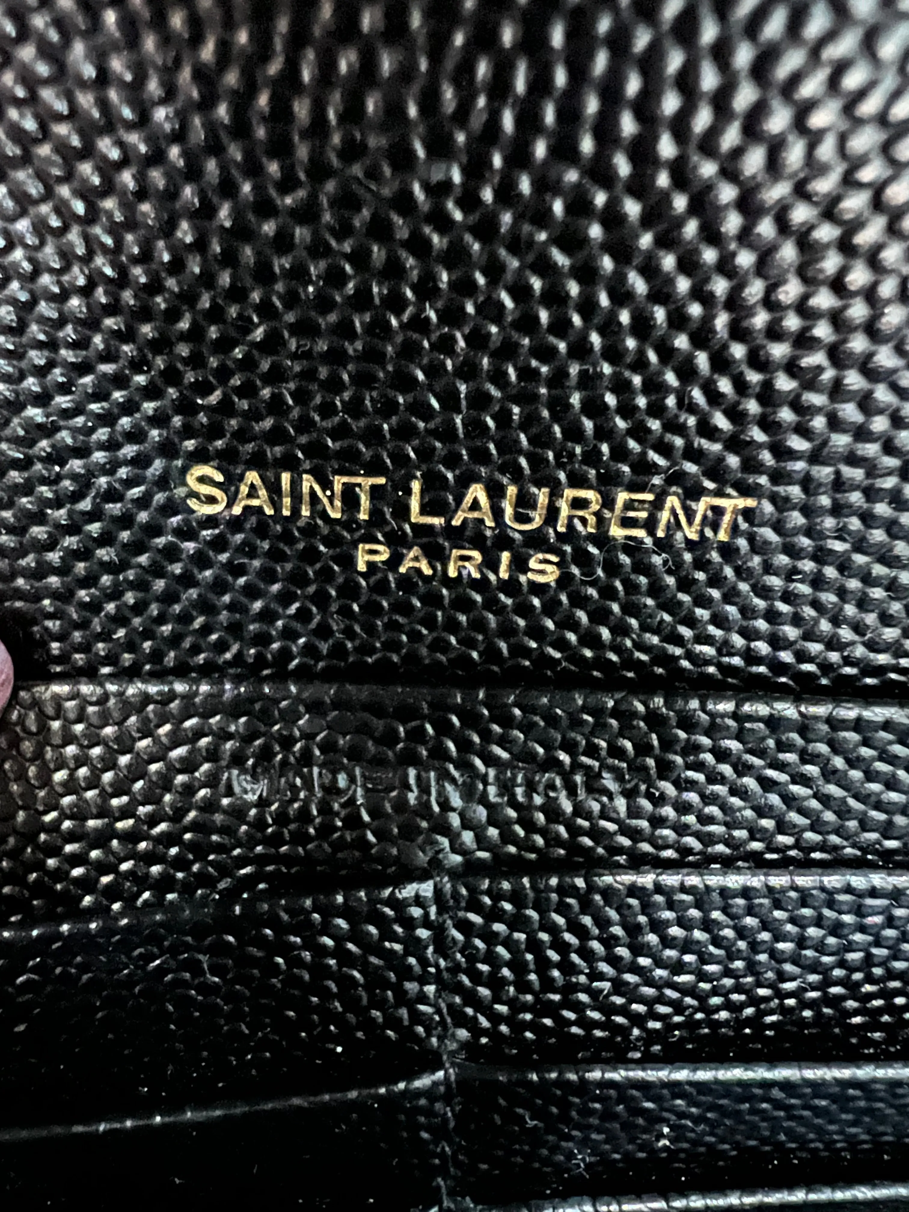 Black YSL cassandre wallet on chain
