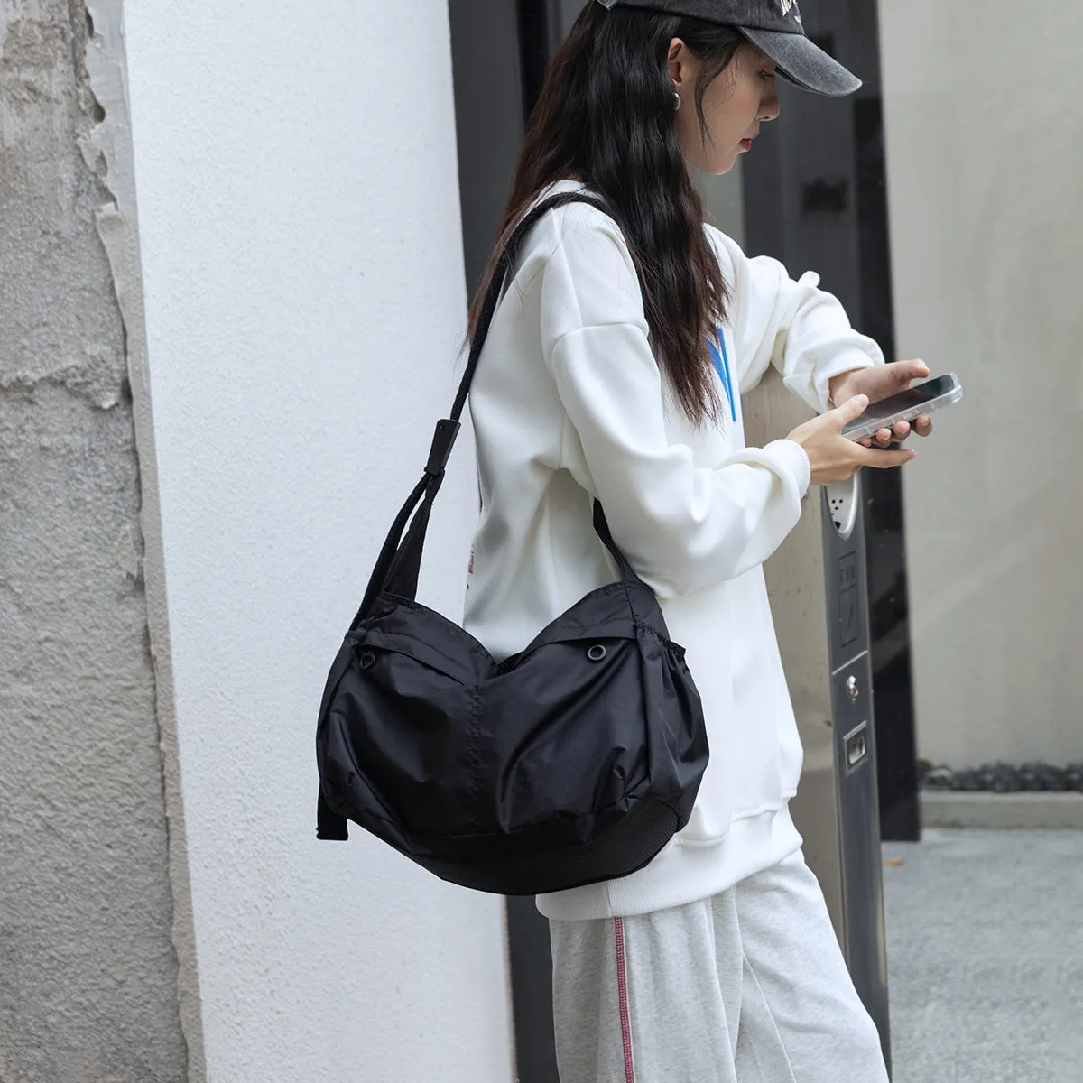 High-grade Nylon Dumpling Unisex Simple Style Crossbody Bags