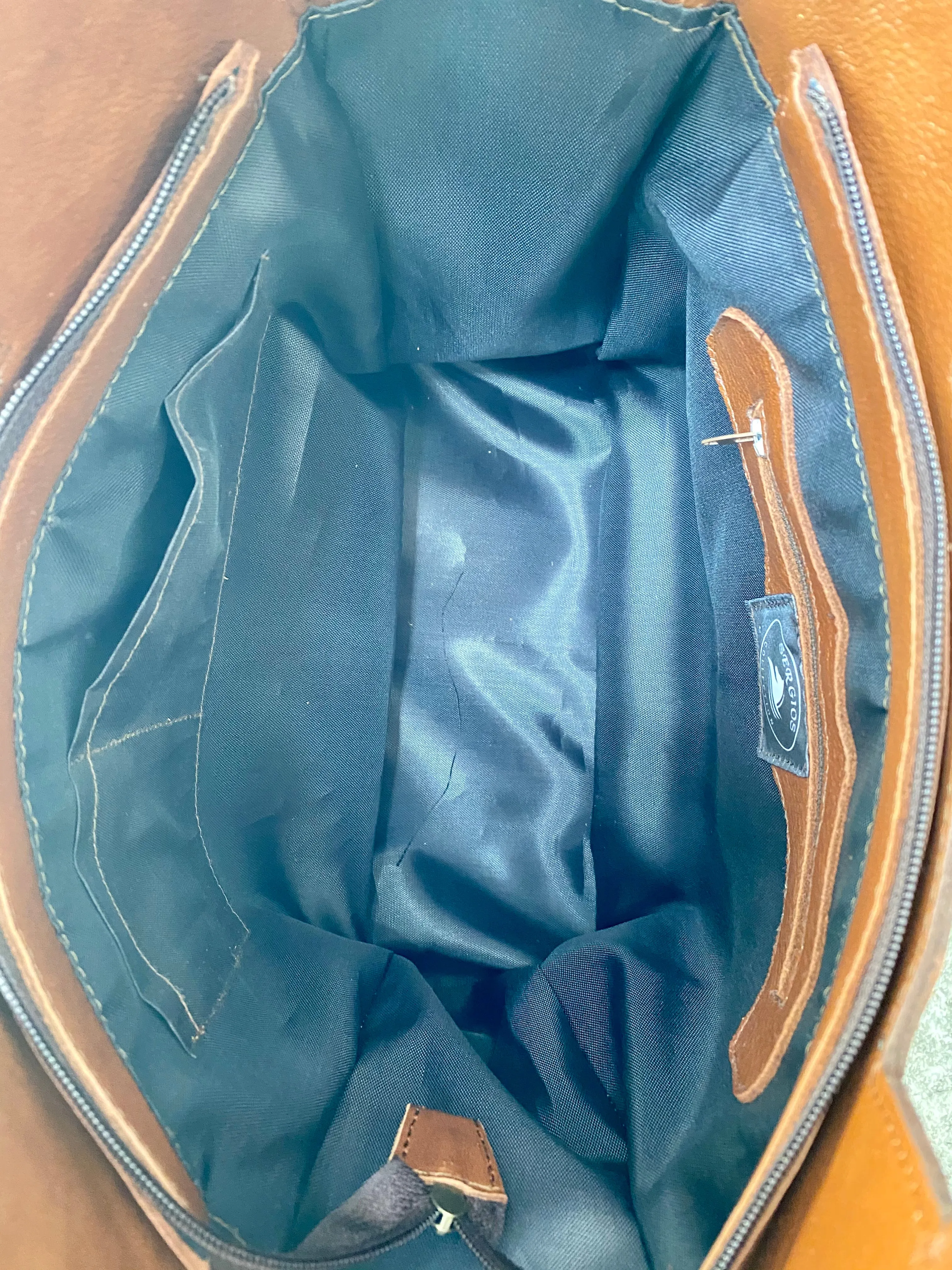 Large cowhide bucket style crossbody.