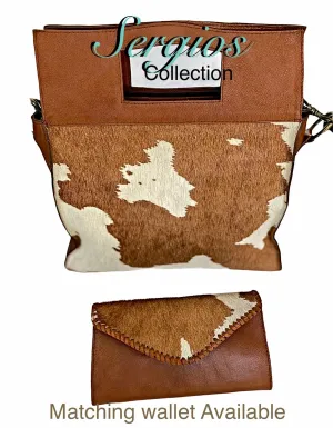 Large cowhide bucket style crossbody.