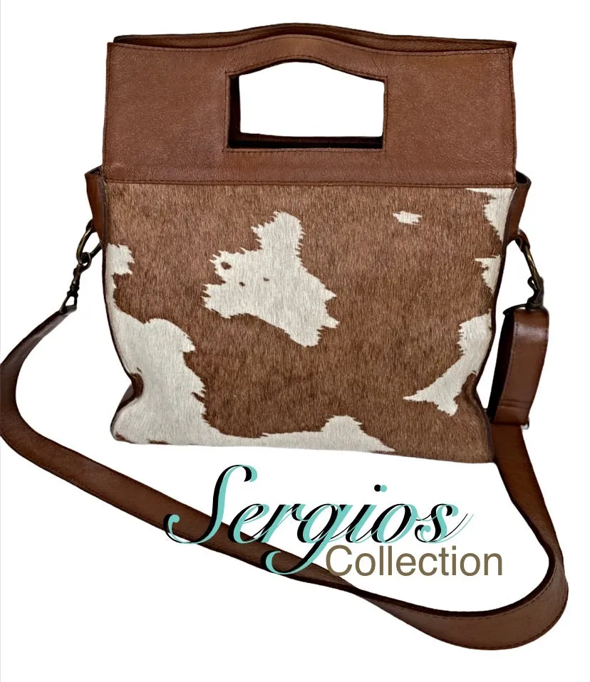 Large cowhide bucket style crossbody.