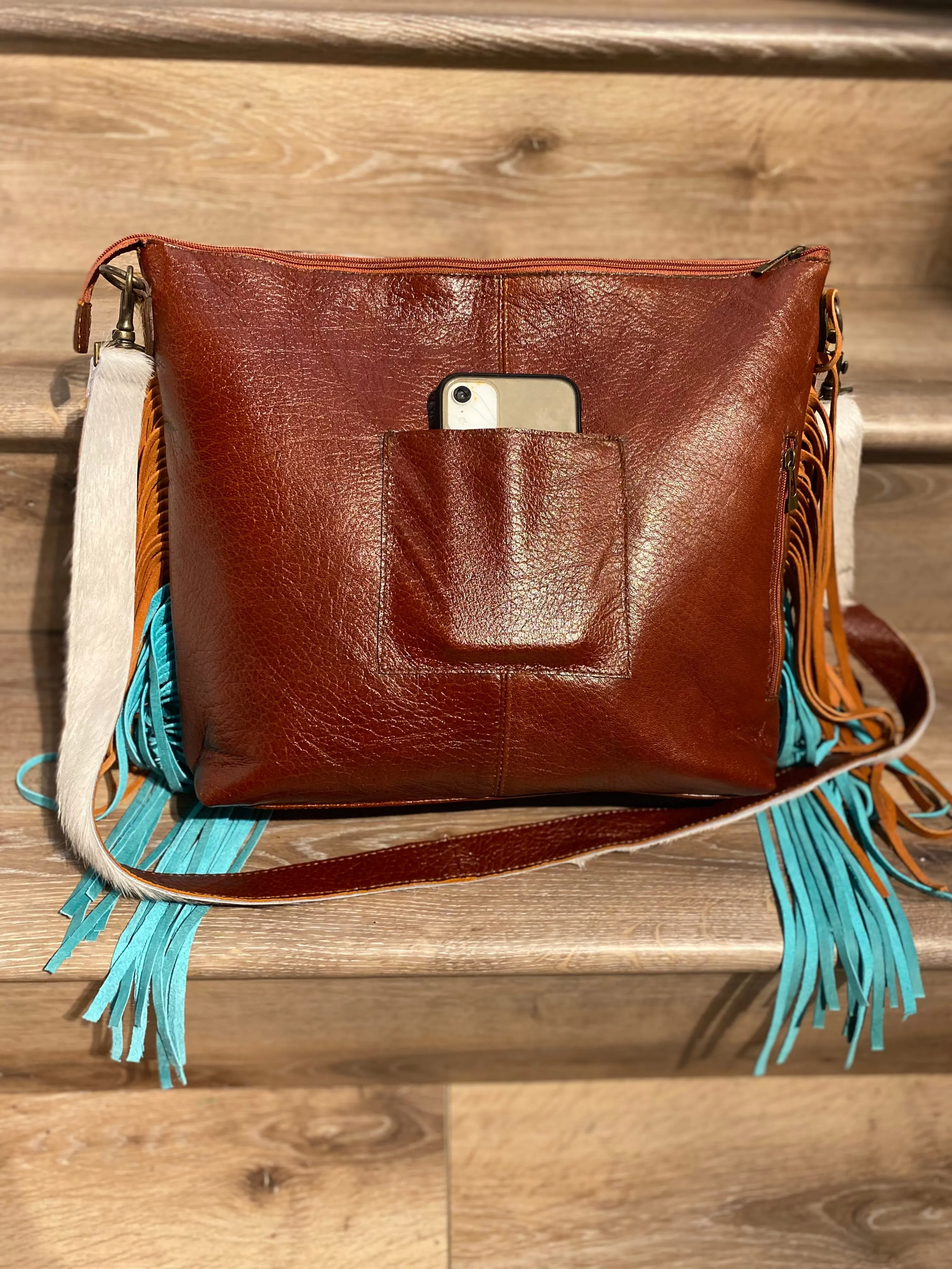 Tote made with genuine leather and cowhide hair on .